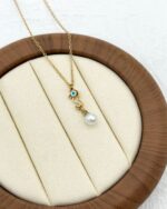 Gold Seahorse Pearl Eye Necklace